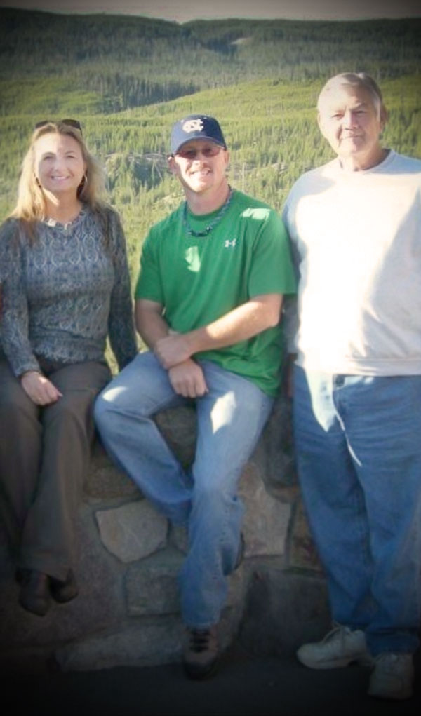 Landmark Memorials founder Timmy Gregg with sister Robin and their father.